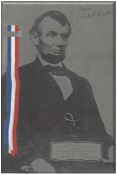 Black and white portrait of Abraham Lincoln with a red, white, and blue ribbon on the side.